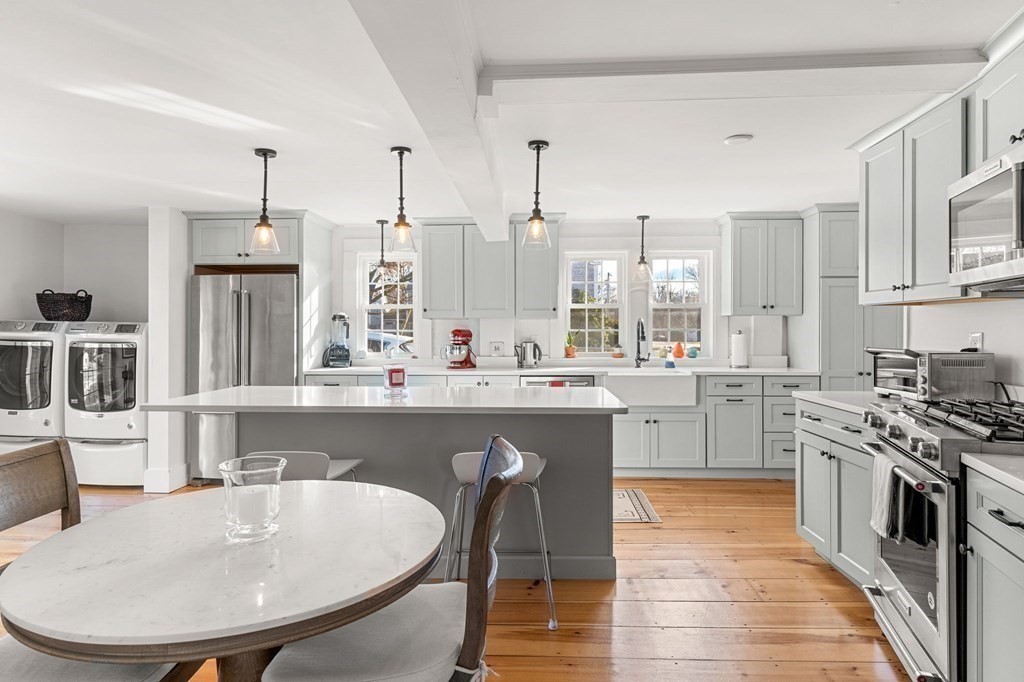 161 High Road Newbury, MA 01951 - Photo 6 of 39 a kitchen with stainless steel appliances granite countertop a white cabinets and a stove