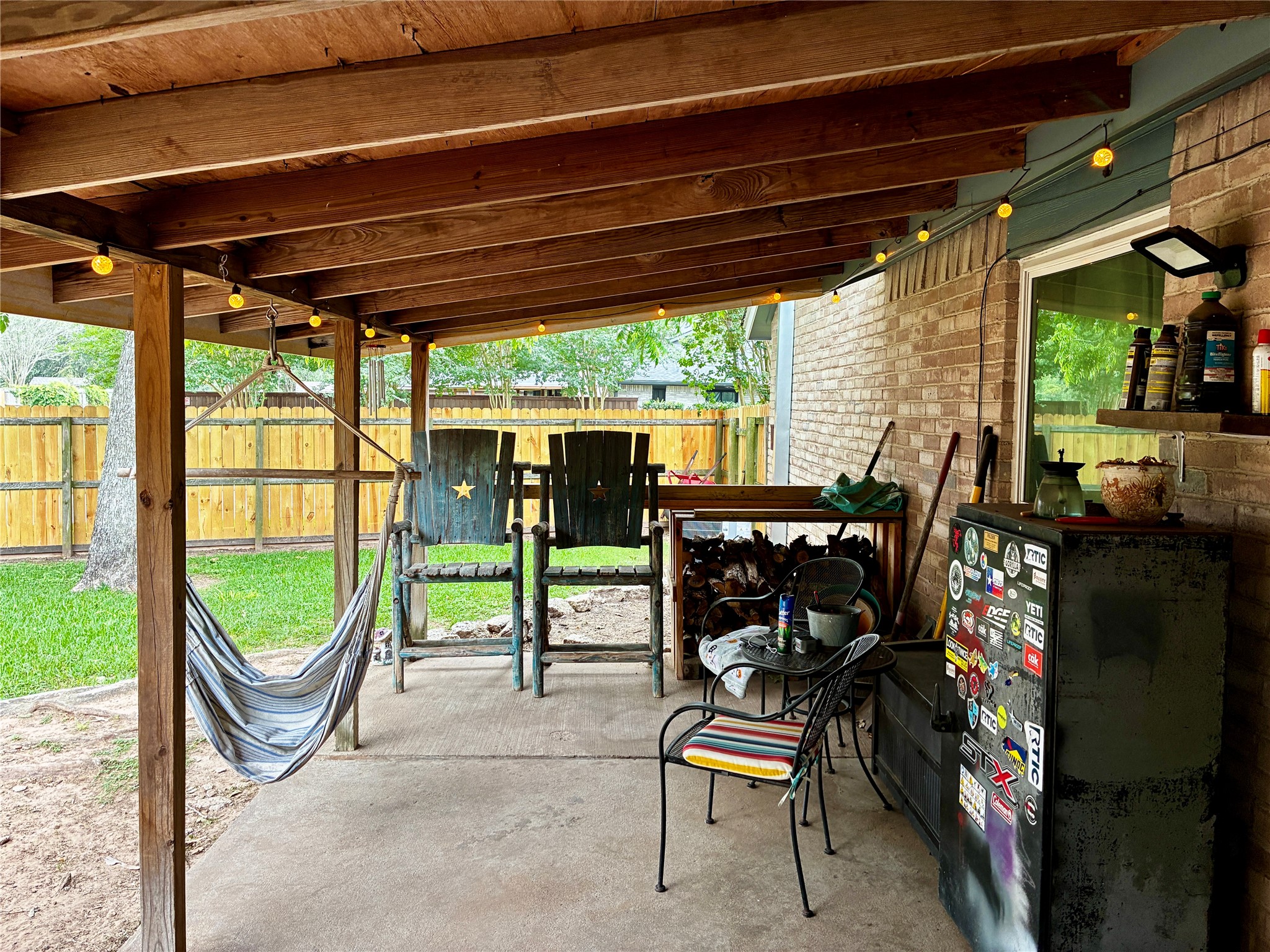 2 Sarita Road Angleton, TX 77515 - Photo 19 of 21 a view of a chairs and table in the patio and a backyard