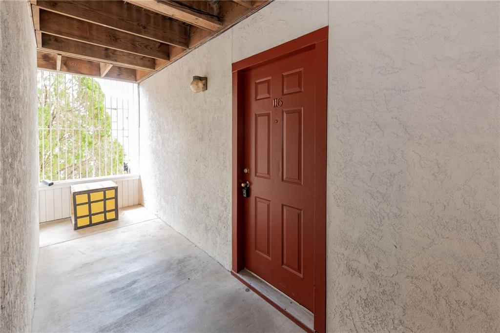3115 Helms Street, Unit 116 Austin, TX 78705 - Photo 12 of 12 Property entrance featuring stucco siding
