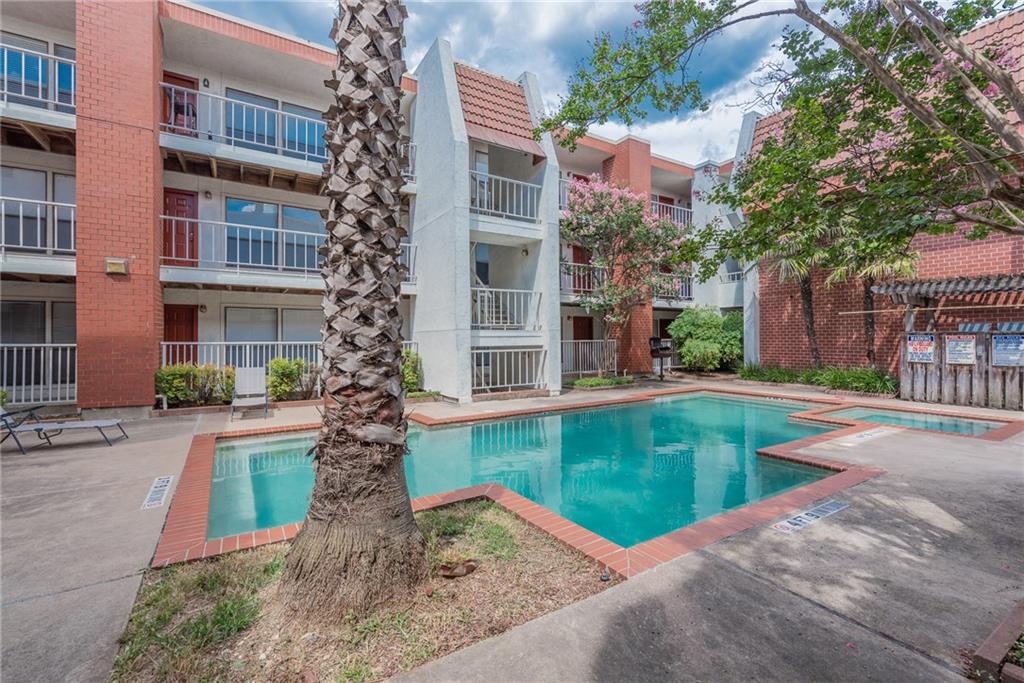 3115 Helms Street, Unit 116 Austin, TX 78705 - Photo 10 of 12 Community pool with a community hot tub, a patio, and grilling area