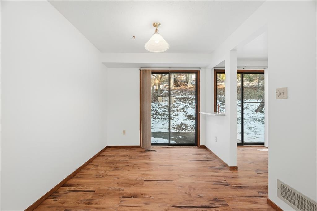 14 Bethany Drive, Unit A Pittsburgh, PA 15215 - Photo 7 of 23 an empty room with wooden floor and windows