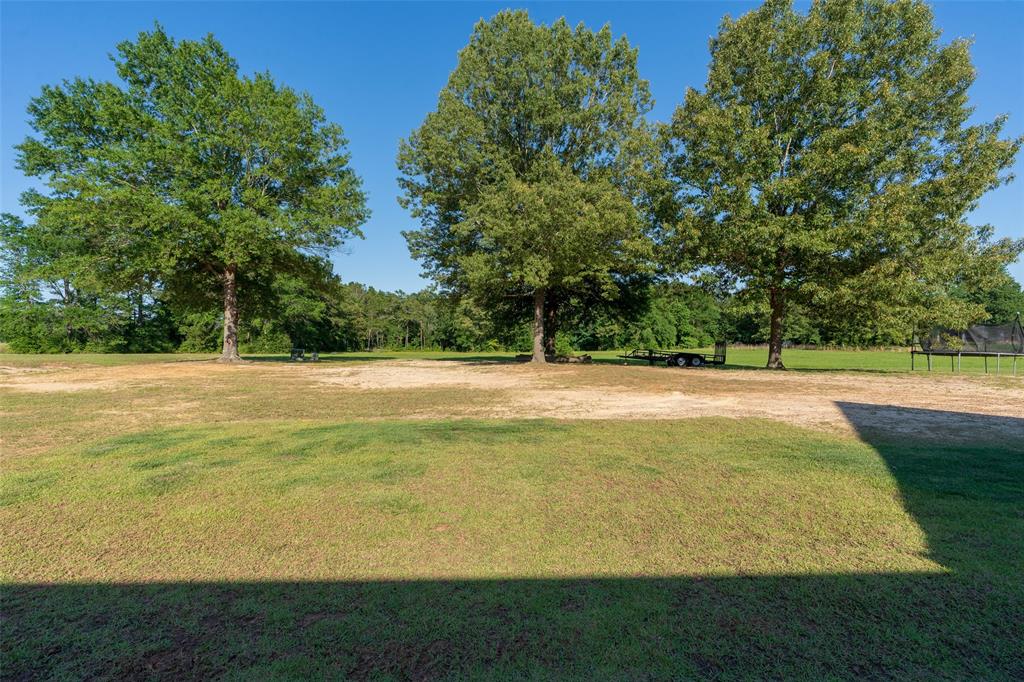 2804 Buchanan Road Hallsville, TX 75650 - Photo 37 of 40 a view of swimming pool with an outdoor space and seating area