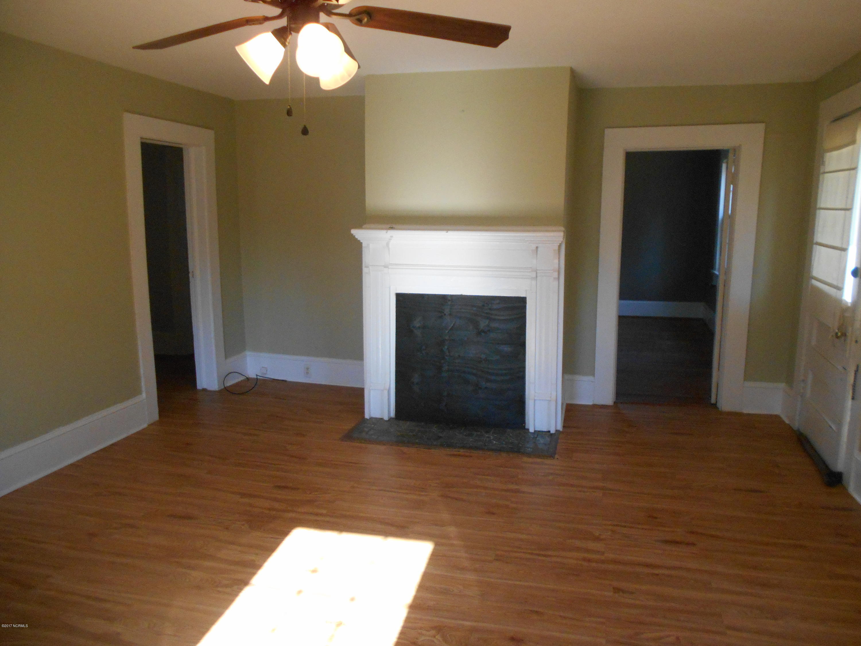 4726 Quaker Road Wilson, NC 27893 - Photo 16 of 33 Large living room with fireplace