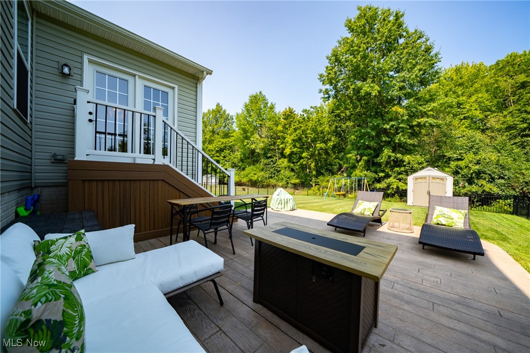 270 Stone Ridge Way Berea, OH 44017 - Photo 29 of 30 Wooden deck with a storage unit and outdoor lounge area