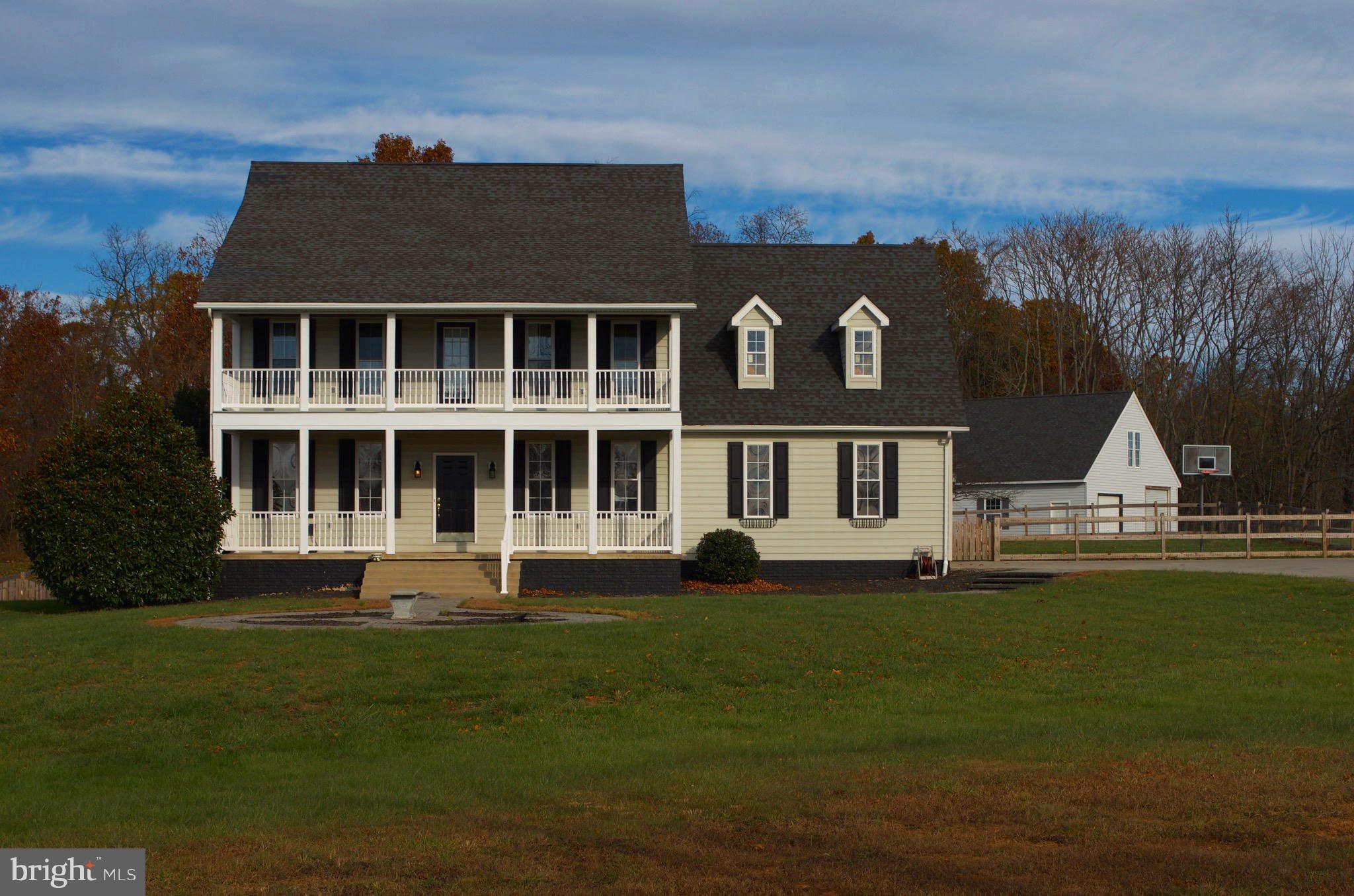 4113 Summit Point Road Charles Town, WV 25414 - Photo 1 of 27 a front view of a house with a yard
