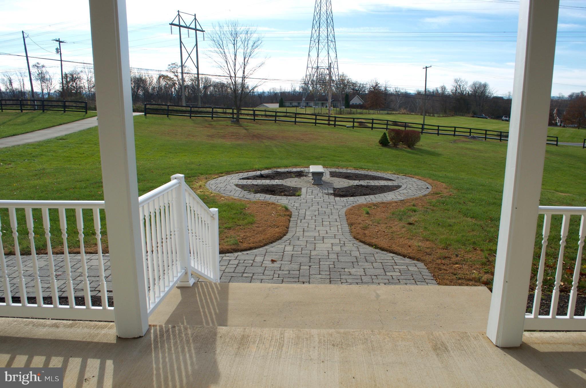 4113 Summit Point Road Charles Town, WV 25414 - Photo 4 of 27 a view of a garden from deck