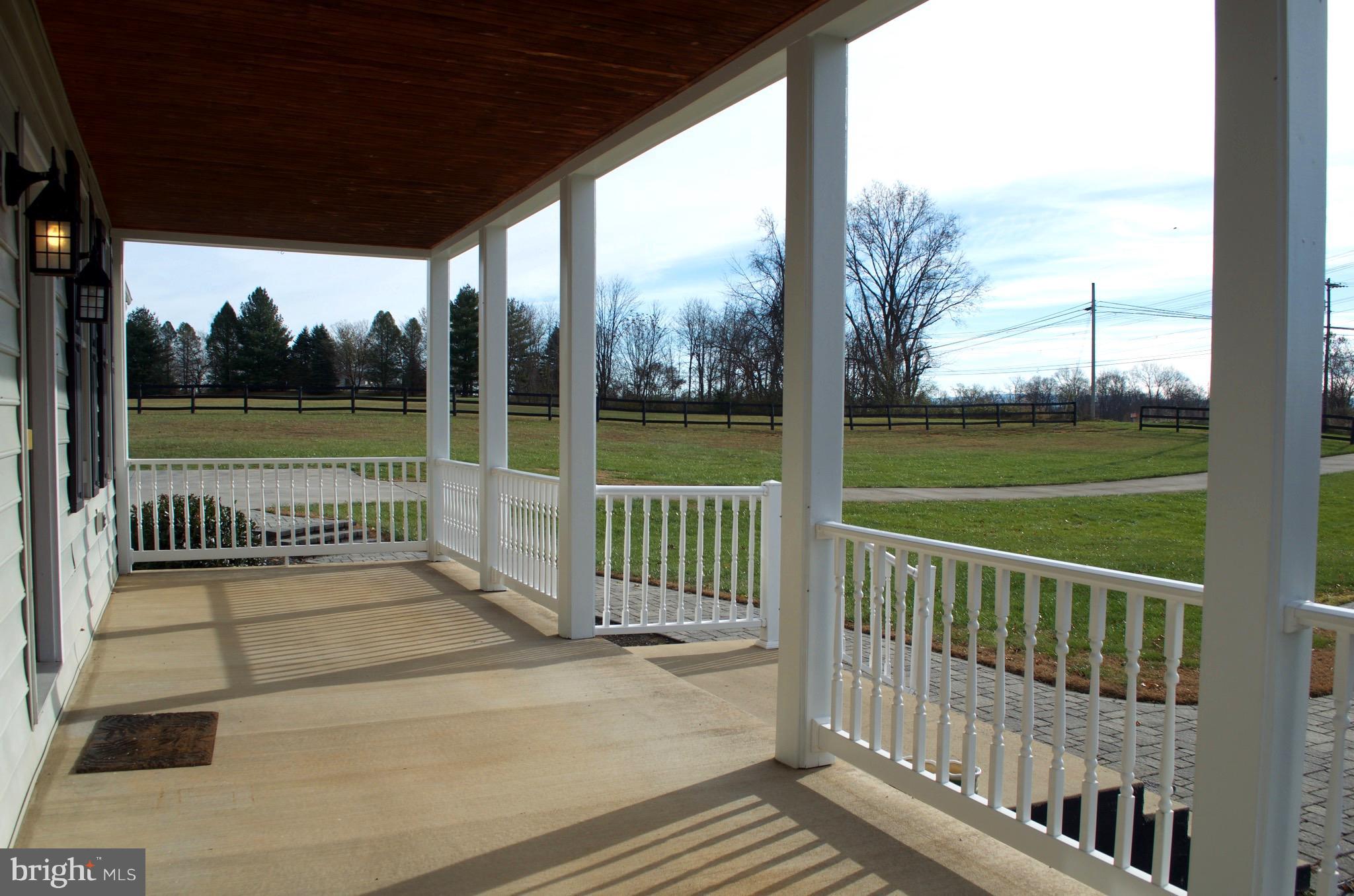 4113 Summit Point Road Charles Town, WV 25414 - Photo 5 of 27 a view of a wooden deck with a big yard