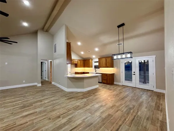 a spacious bathroom with a sink and a mirror