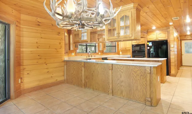 a view of a room with a large window and front door