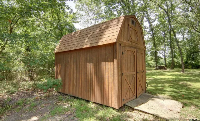 a view of yard with patio