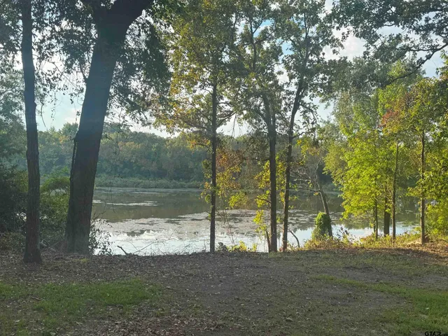 an aerial view of a city with lake view