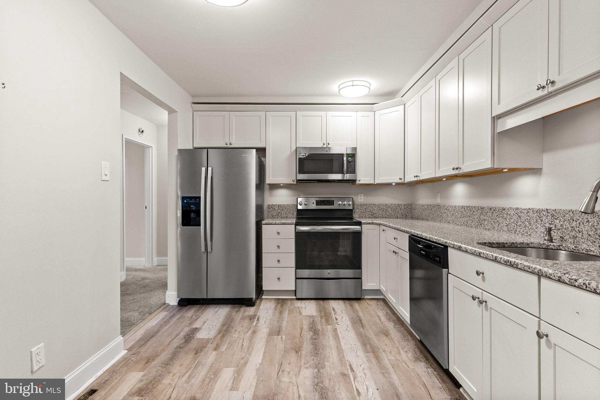1402 Raintree Lane, Unit 1402 Malvern, PA 19355 - Photo 11 of 32 Modern kitchen with sleek appliances.