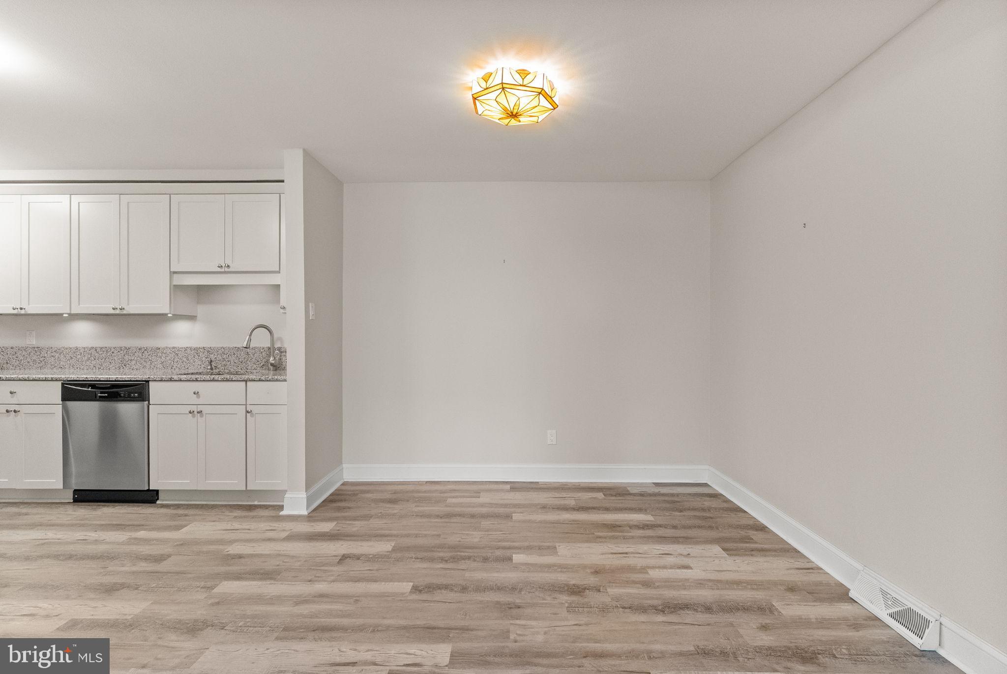 1402 Raintree Lane, Unit 1402 Malvern, PA 19355 - Photo 16 of 32 Modern kitchen with dining area