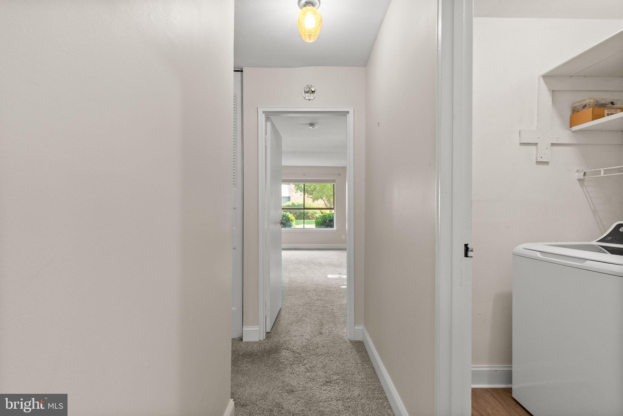 1402 Raintree Lane, Unit 1402 Malvern, PA 19355 - Photo 18 of 32 Bright hallway leading to inviting spaces.