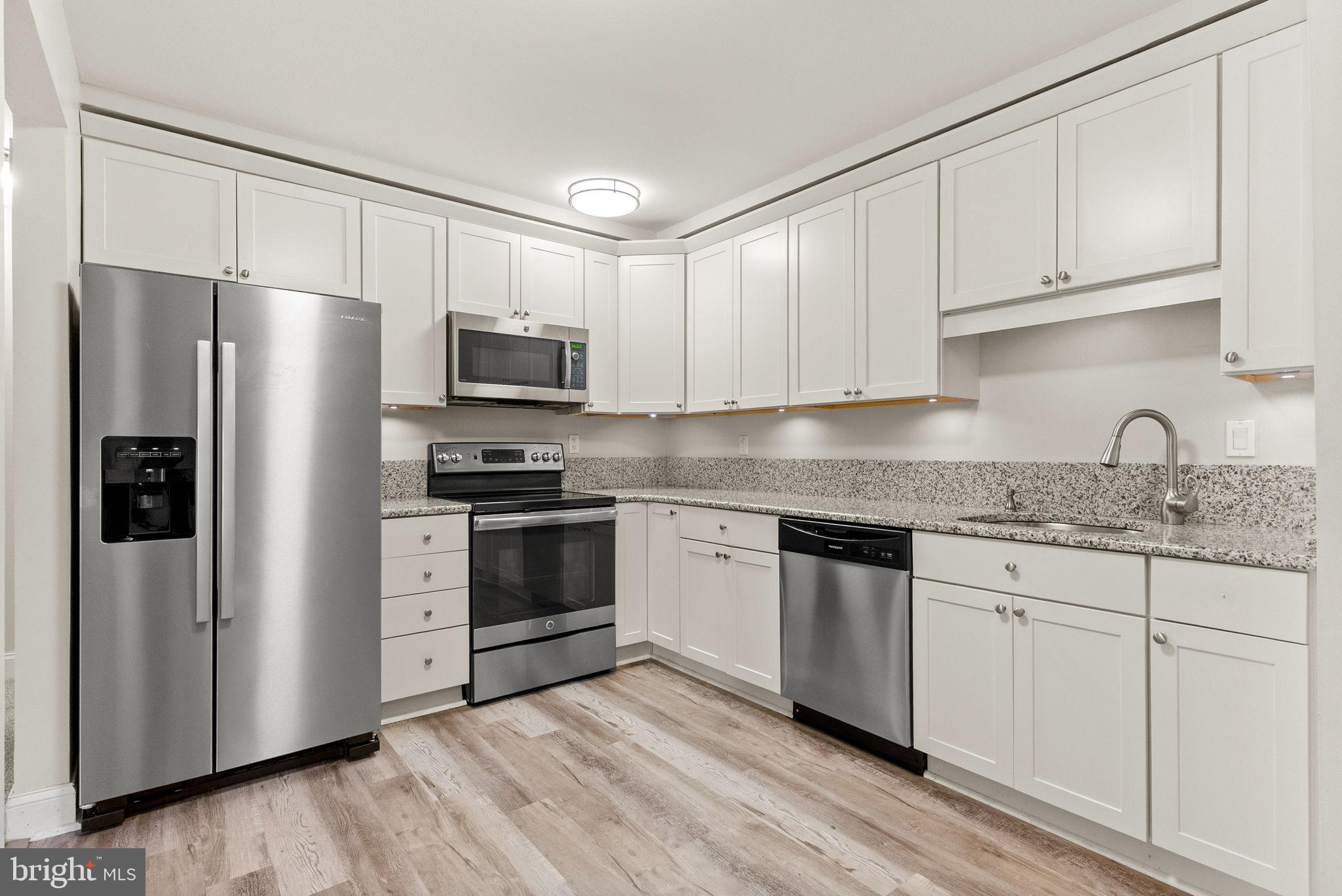 1402 Raintree Lane, Unit 1402 Malvern, PA 19355 - Photo 10 of 32 Modern kitchen with sleek stainless appliances.