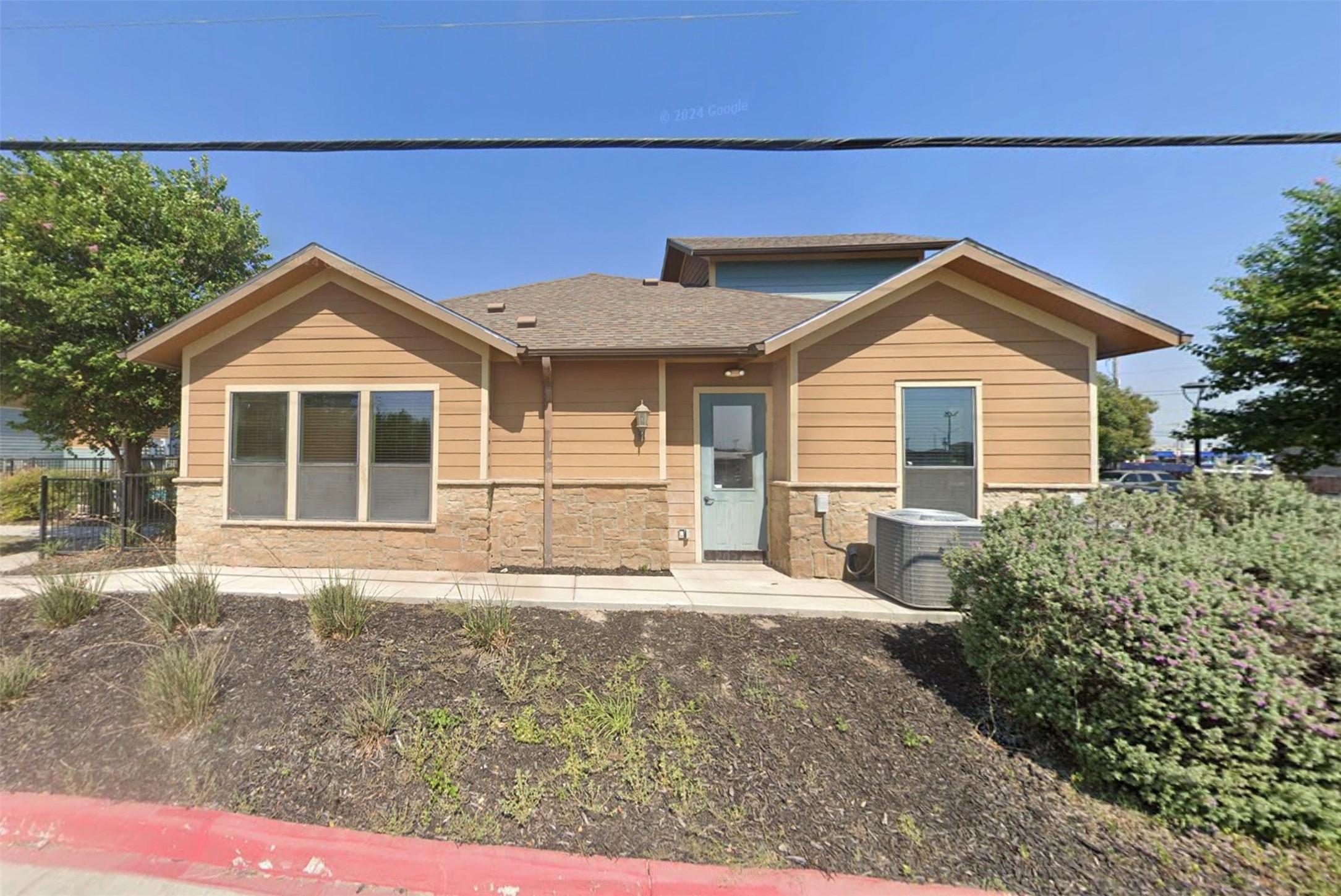 163 Yucca Park Road Del Rio, TX 78840 - Photo 4 of 6 a front view of a house with a garden and yard