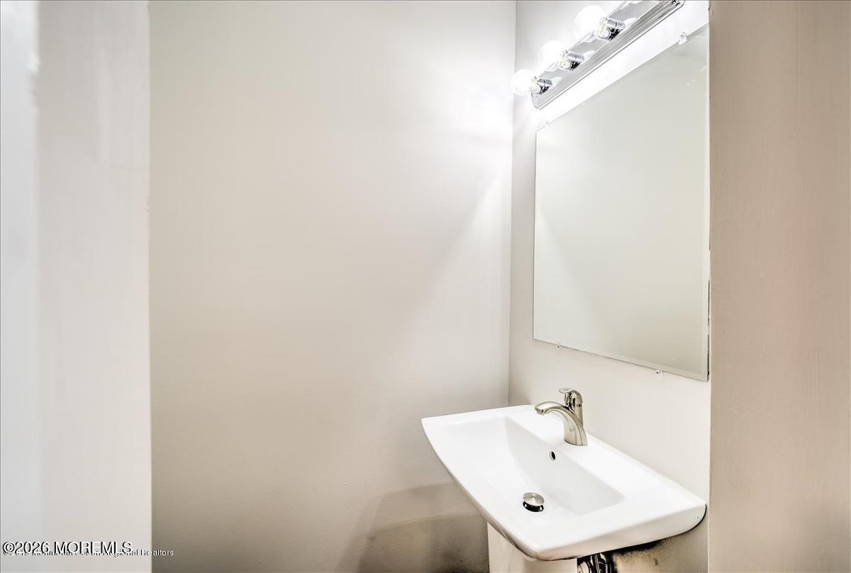 699 Aldrich Road Howell, NJ 07731 - Photo 14 of 23 a white sink sitting next to a white sink