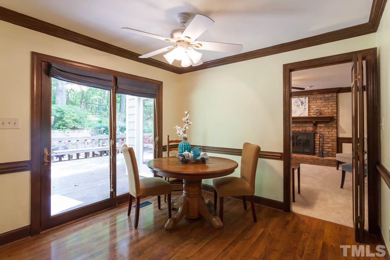 2901 Patrie Place Raleigh, NC 27613 - Photo 12 of 25 a view of a dining room with furniture window and wooden floor