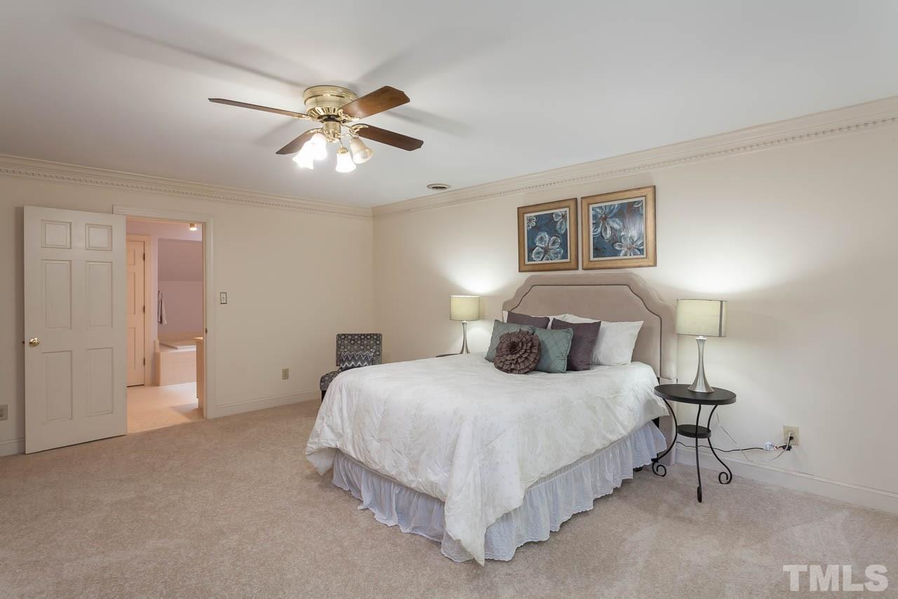 2901 Patrie Place Raleigh, NC 27613 - Photo 14 of 25 a bedroom with a bed and window