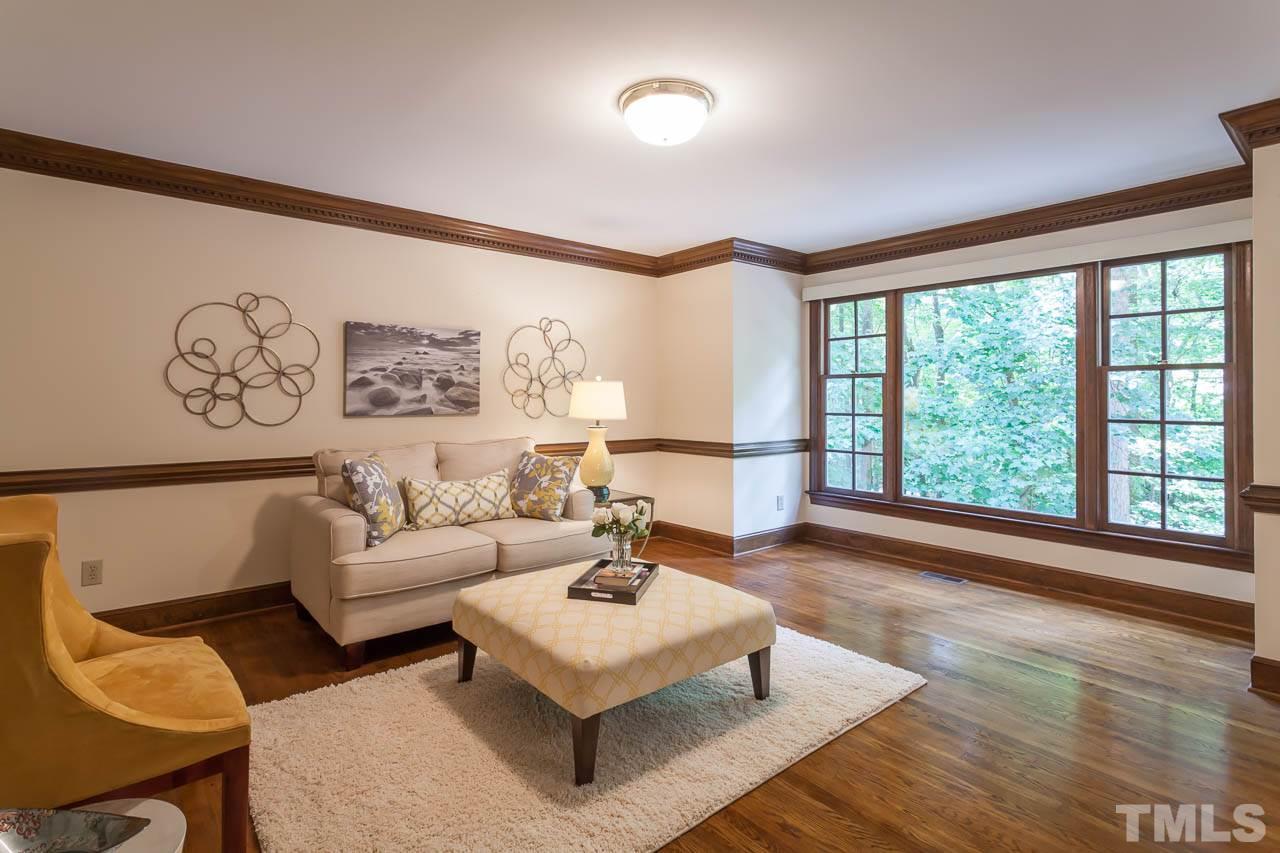 2901 Patrie Place Raleigh, NC 27613 - Photo 3 of 25 a living room with furniture and a large window
