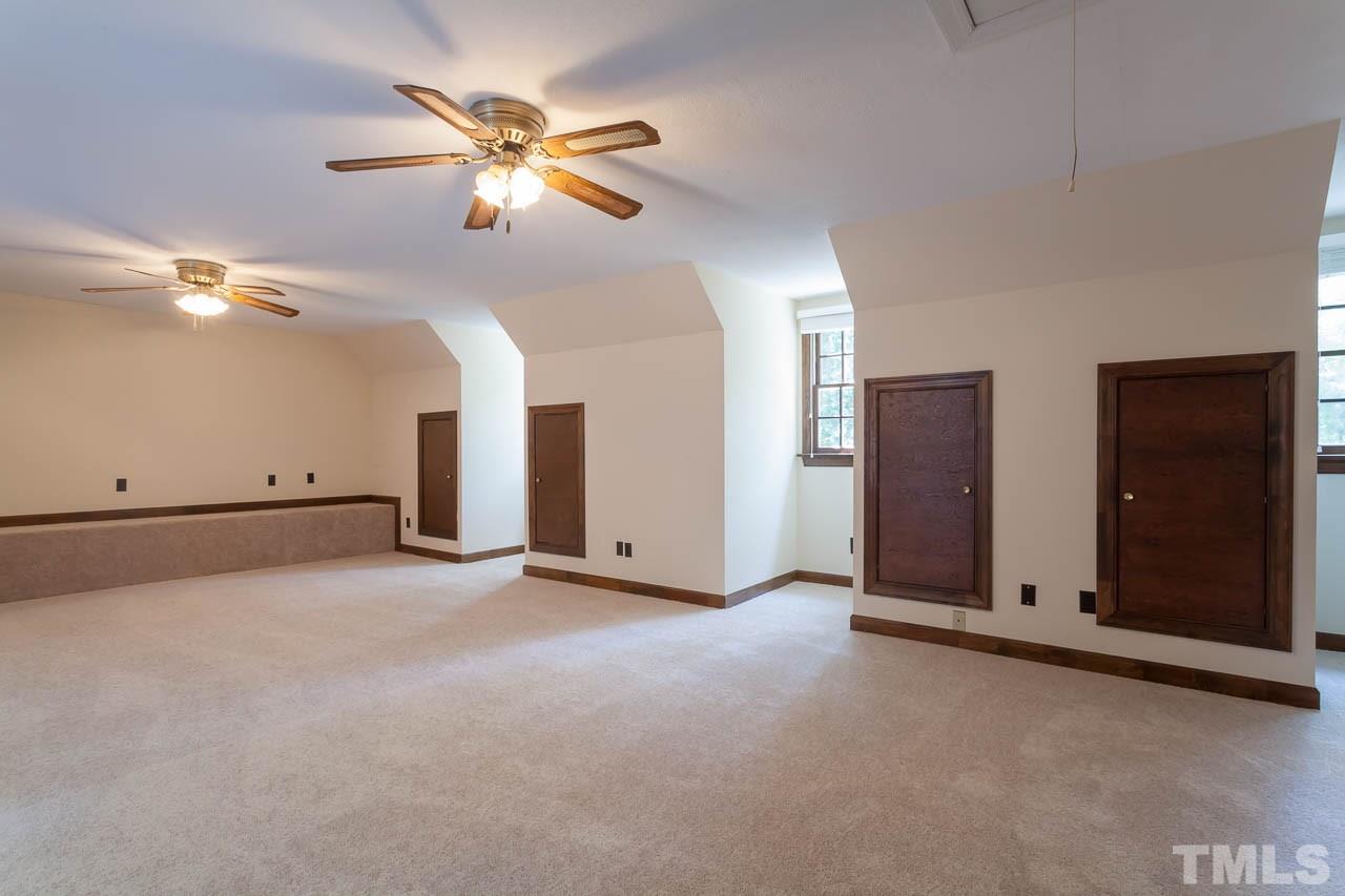 2901 Patrie Place Raleigh, NC 27613 - Photo 22 of 25 an empty room with closet and fan