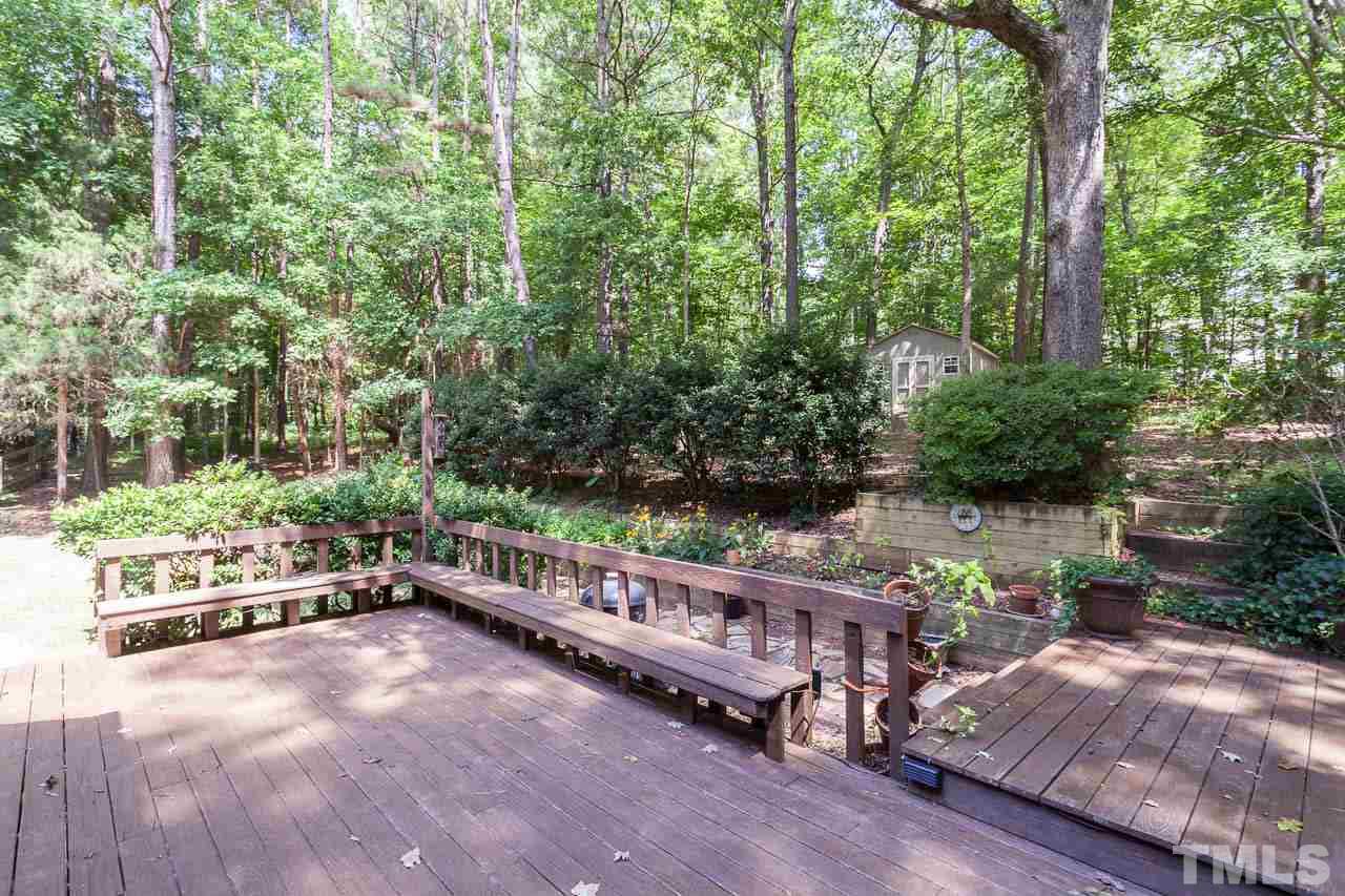 2901 Patrie Place Raleigh, NC 27613 - Photo 23 of 25 a view of a bench with trees in the background