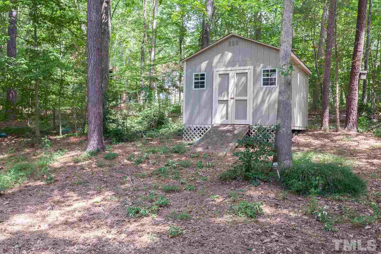 2901 Patrie Place Raleigh, NC 27613 - Photo 25 of 25 a view of a house with yard and large trees