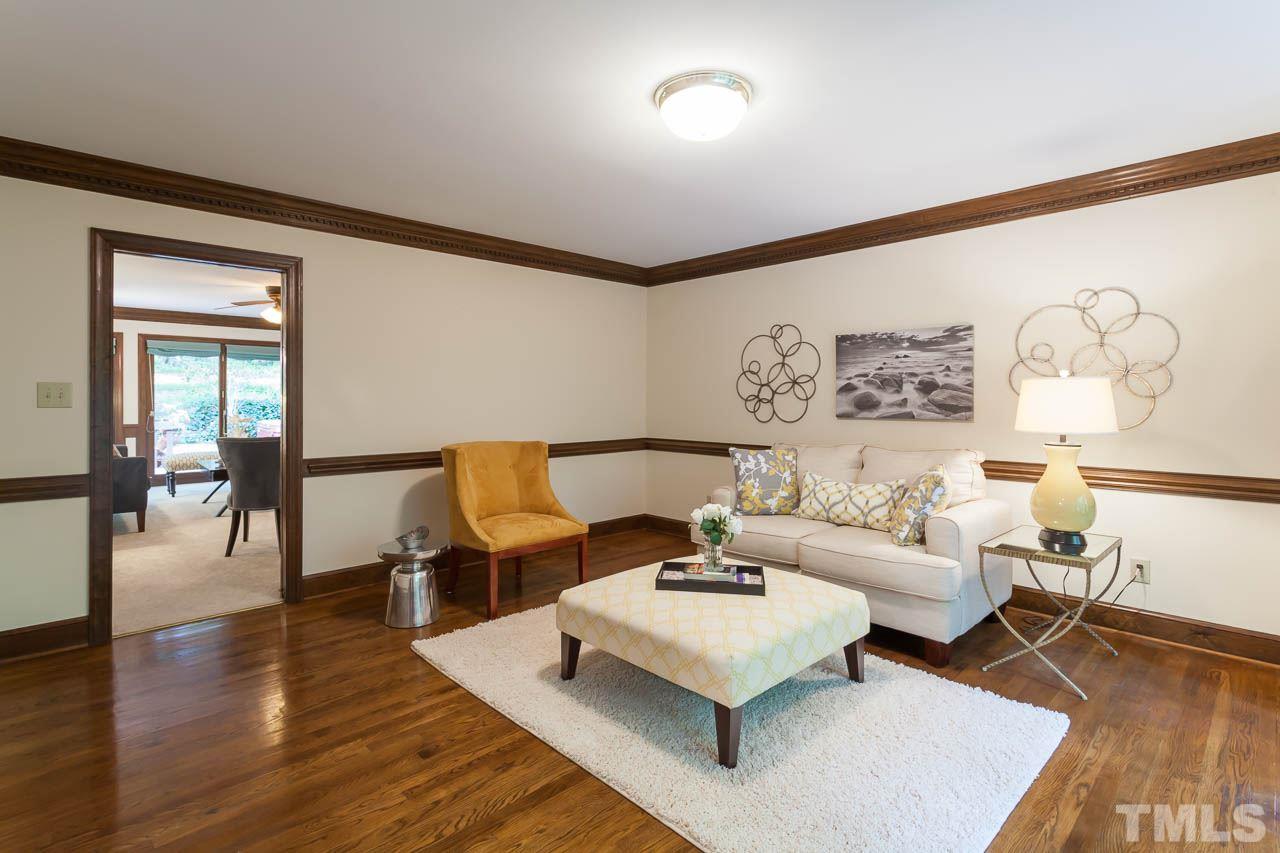 2901 Patrie Place Raleigh, NC 27613 - Photo 4 of 25 a living room with furniture and wooden floor