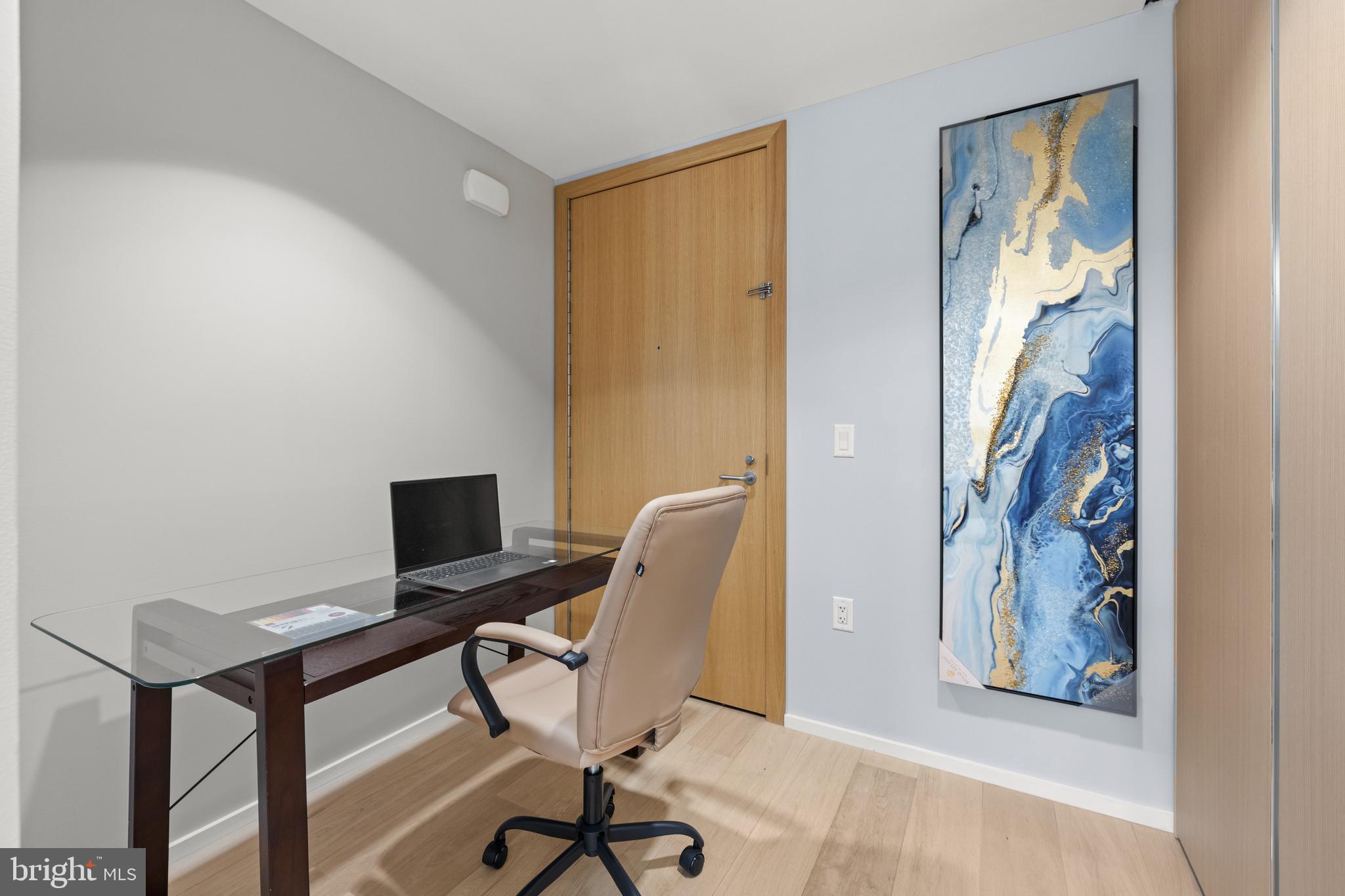 920 I Street Northwest, Unit 504505 Washington, DC 20001 - Photo 15 of 68 a view of a workspace with furniture and a window