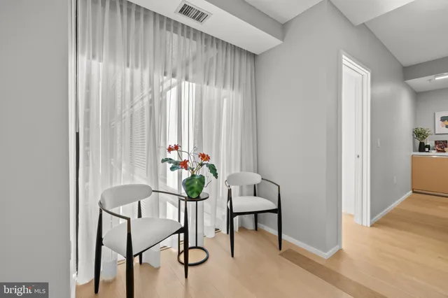 a bedroom with a bed and cupboard