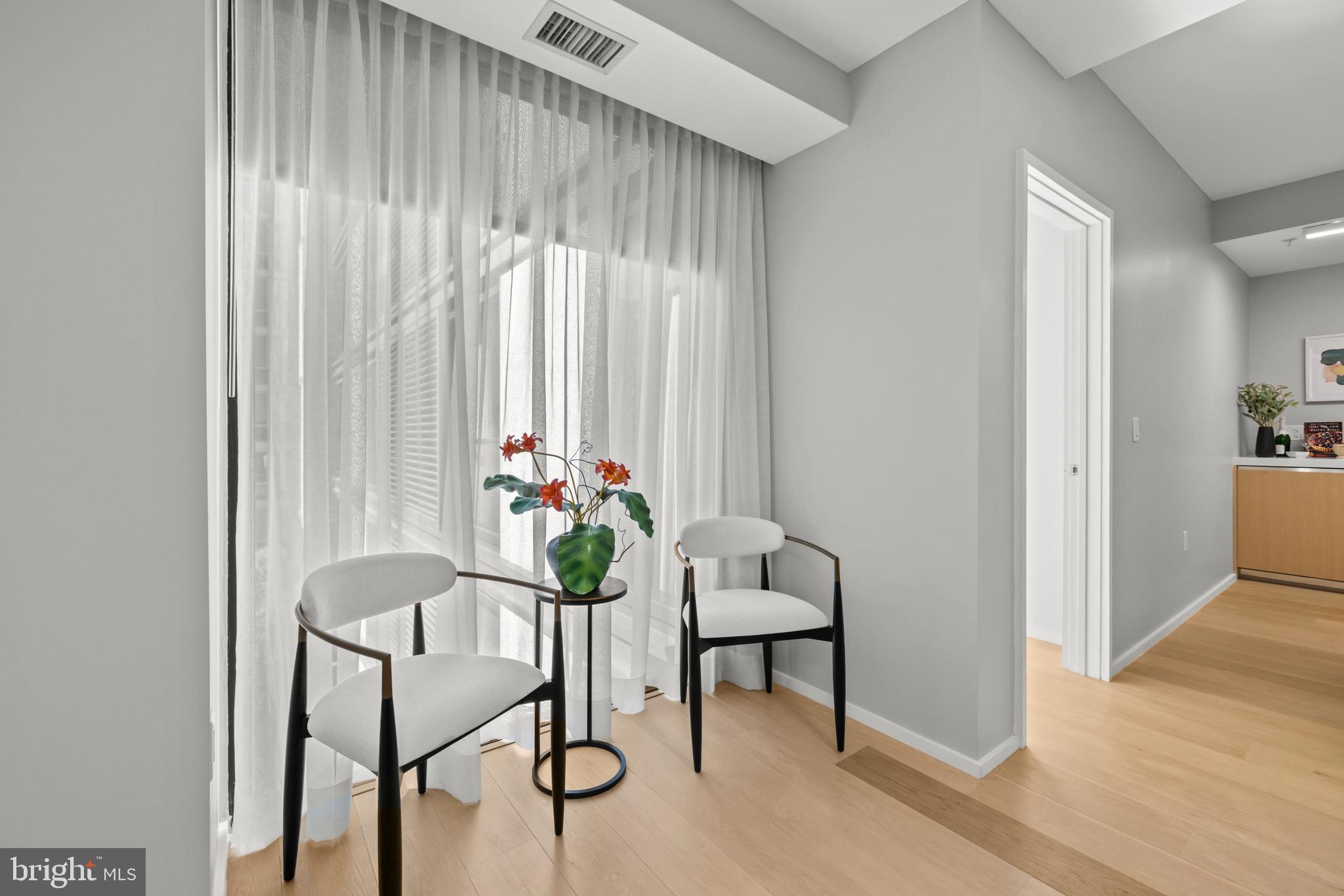 920 I Street Northwest, Unit 504505 Washington, DC 20001 - Photo 27 of 68 a dining room with furniture and a potted plant