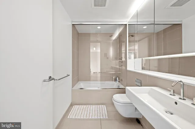 a view of a patio with table and chairs and potted plants