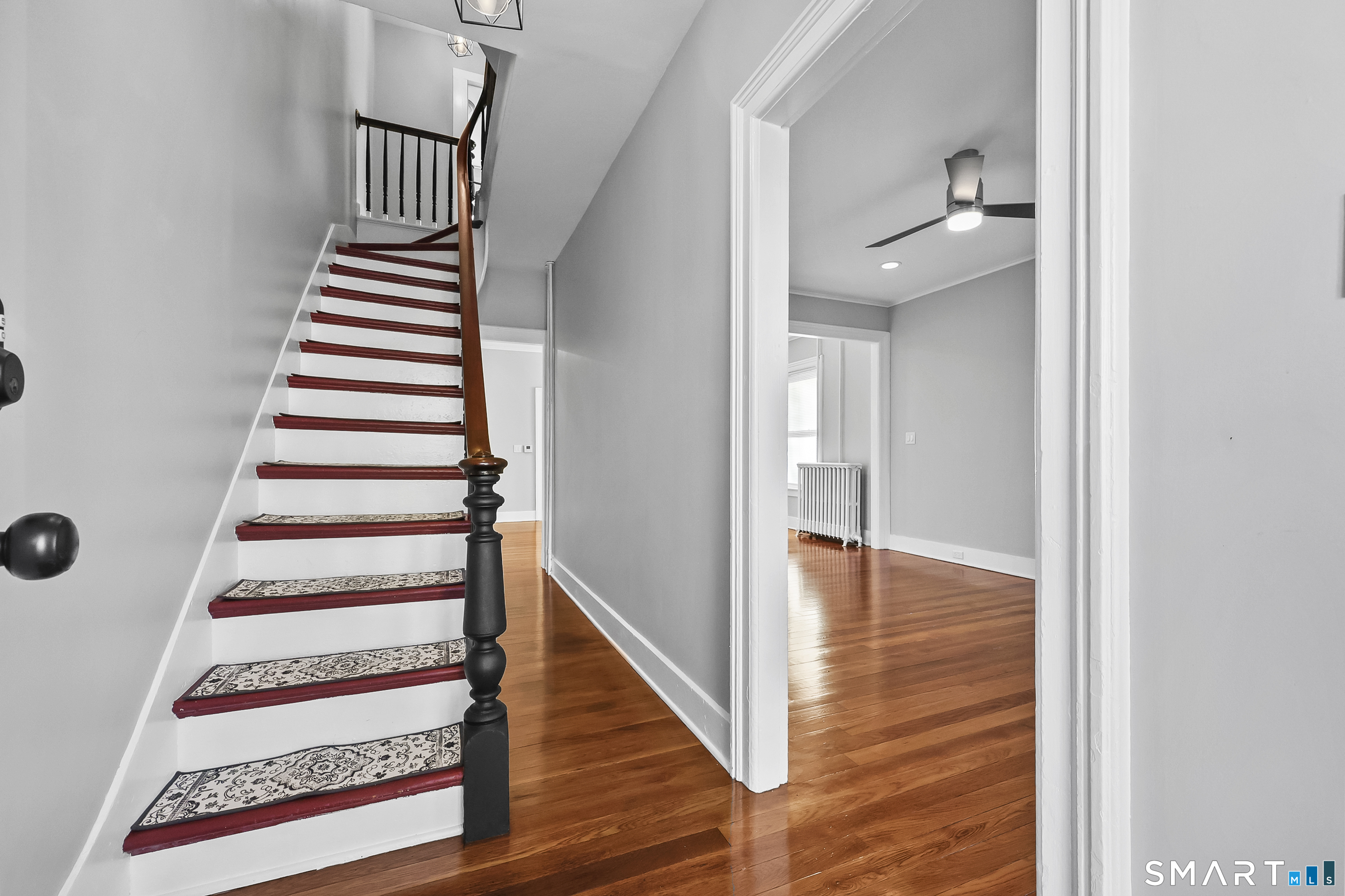 59 Grand Street Middletown, CT 06457 - Photo 12 of 33 a view of a hallway with wooden floor and entryway