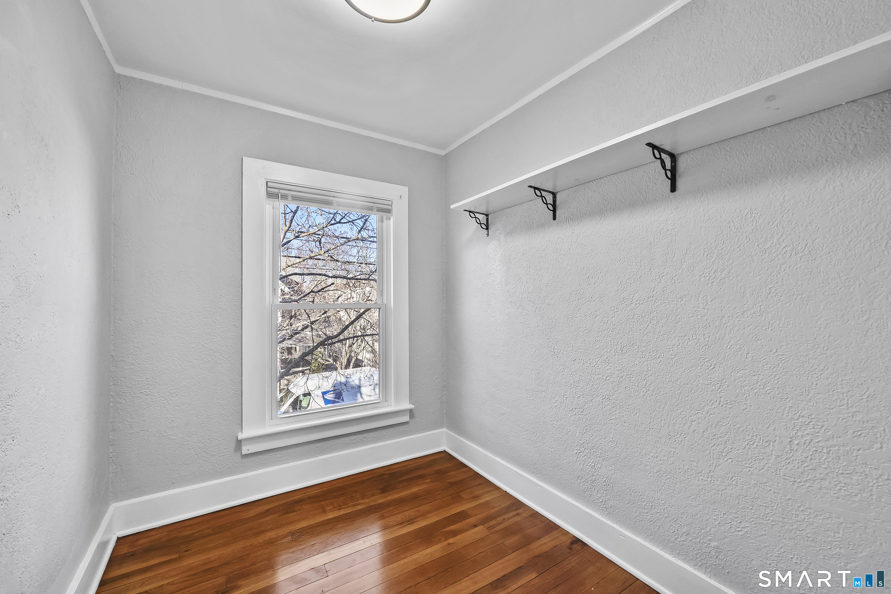 59 Grand Street Middletown, CT 06457 - Photo 20 of 33 a view of a hallway with window