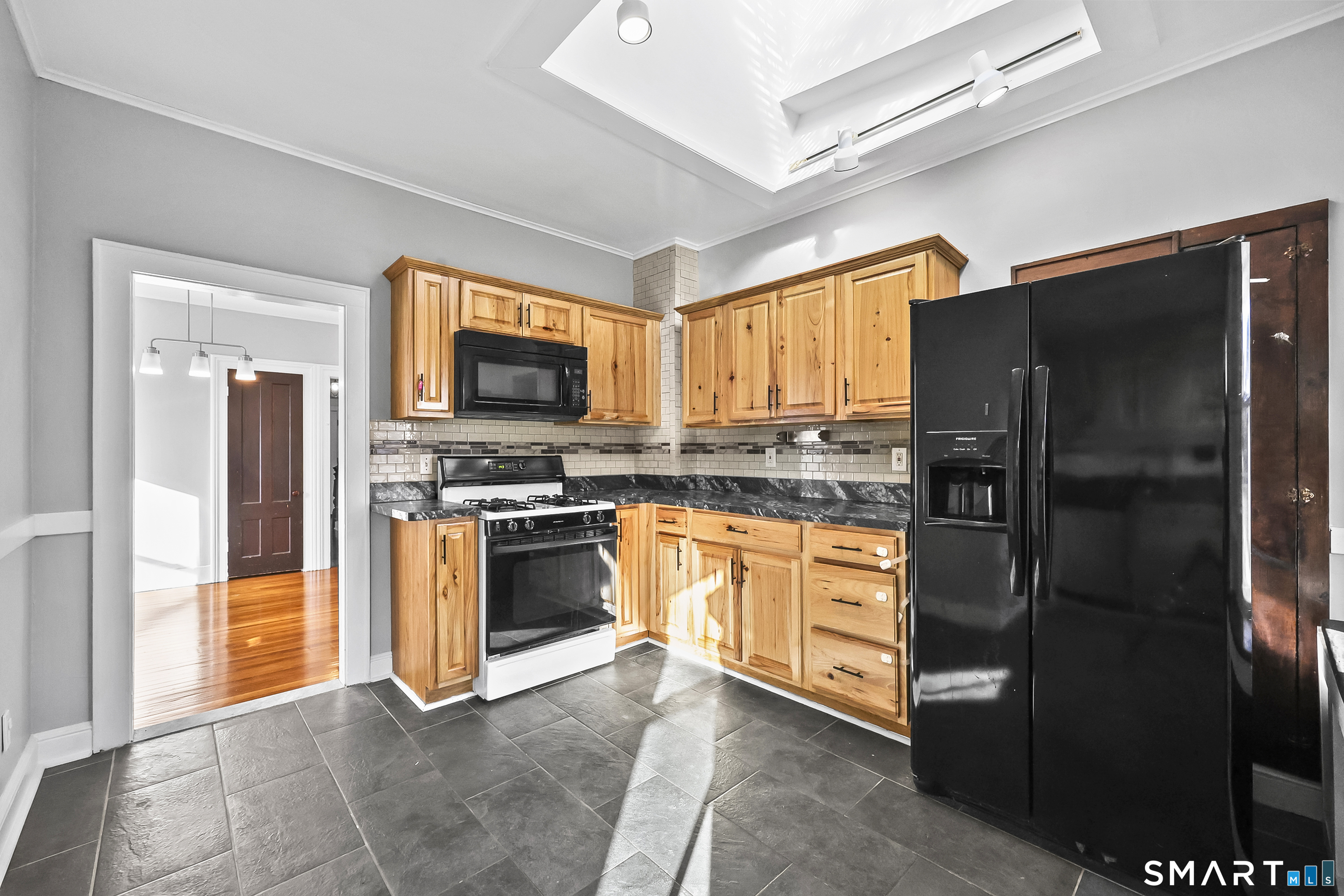 59 Grand Street Middletown, CT 06457 - Photo 3 of 33 a kitchen with stainless steel appliances granite countertop a refrigerator stove and oven