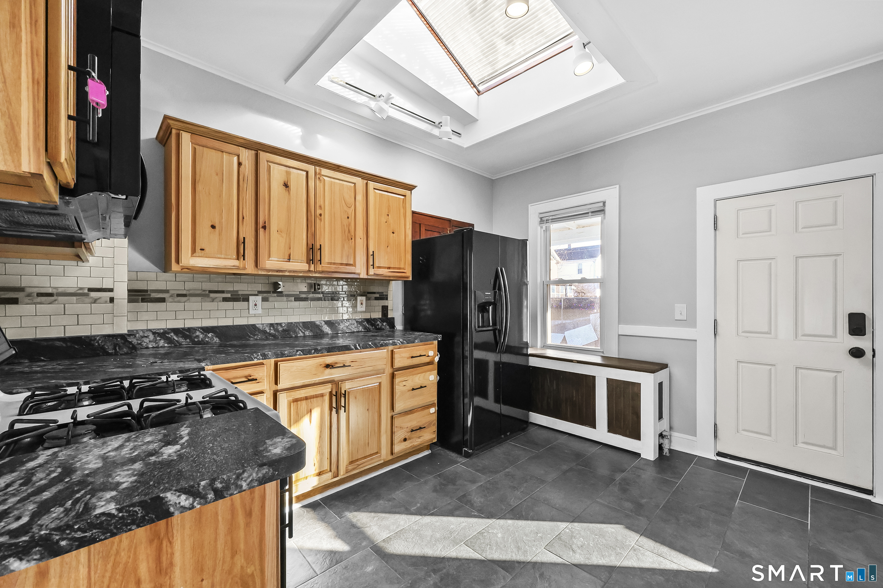 59 Grand Street Middletown, CT 06457 - Photo 4 of 33 a kitchen with stainless steel appliances granite countertop a stove sink and refrigerator