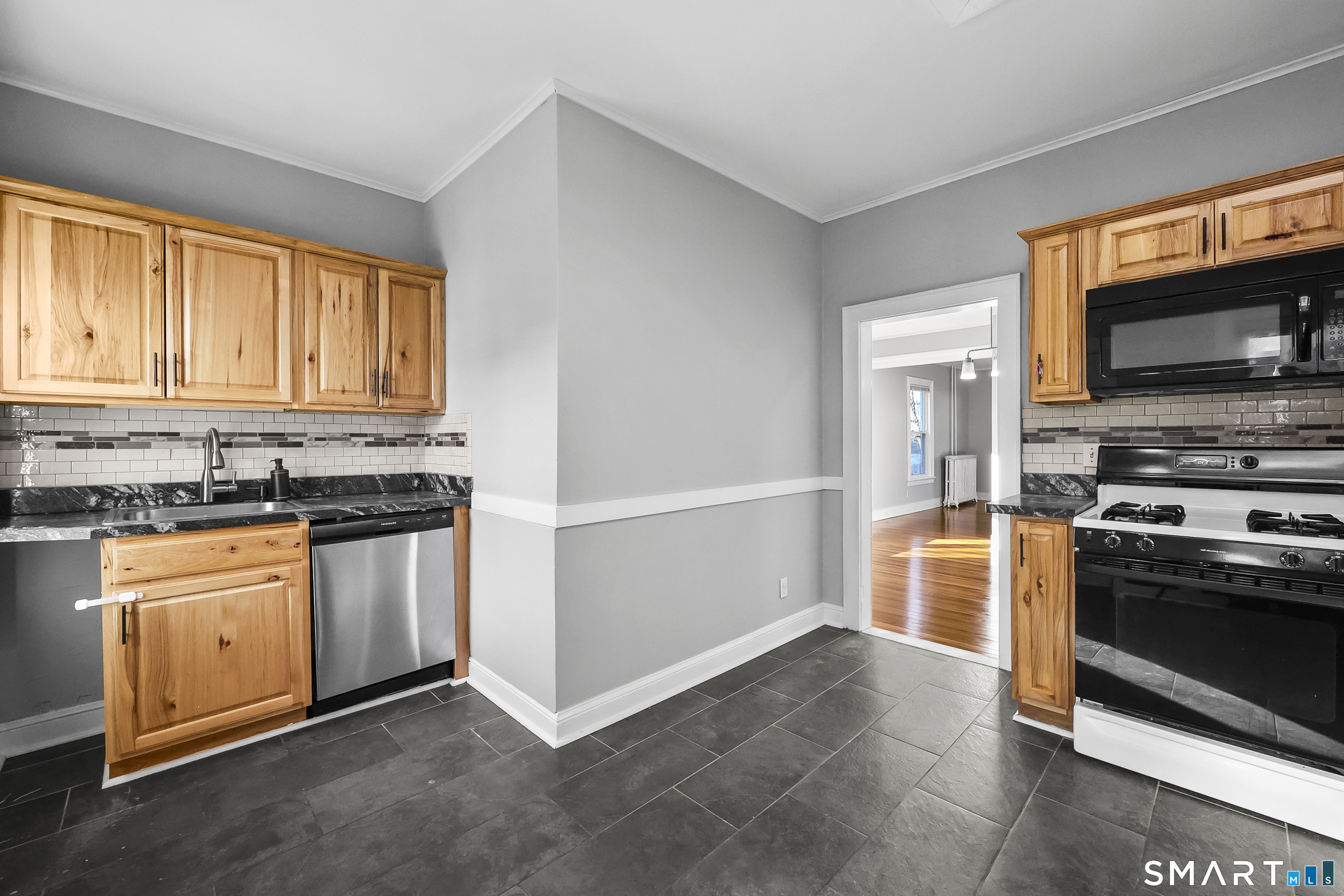 59 Grand Street Middletown, CT 06457 - Photo 5 of 33 a kitchen with stainless steel appliances granite countertop a refrigerator stove and sink