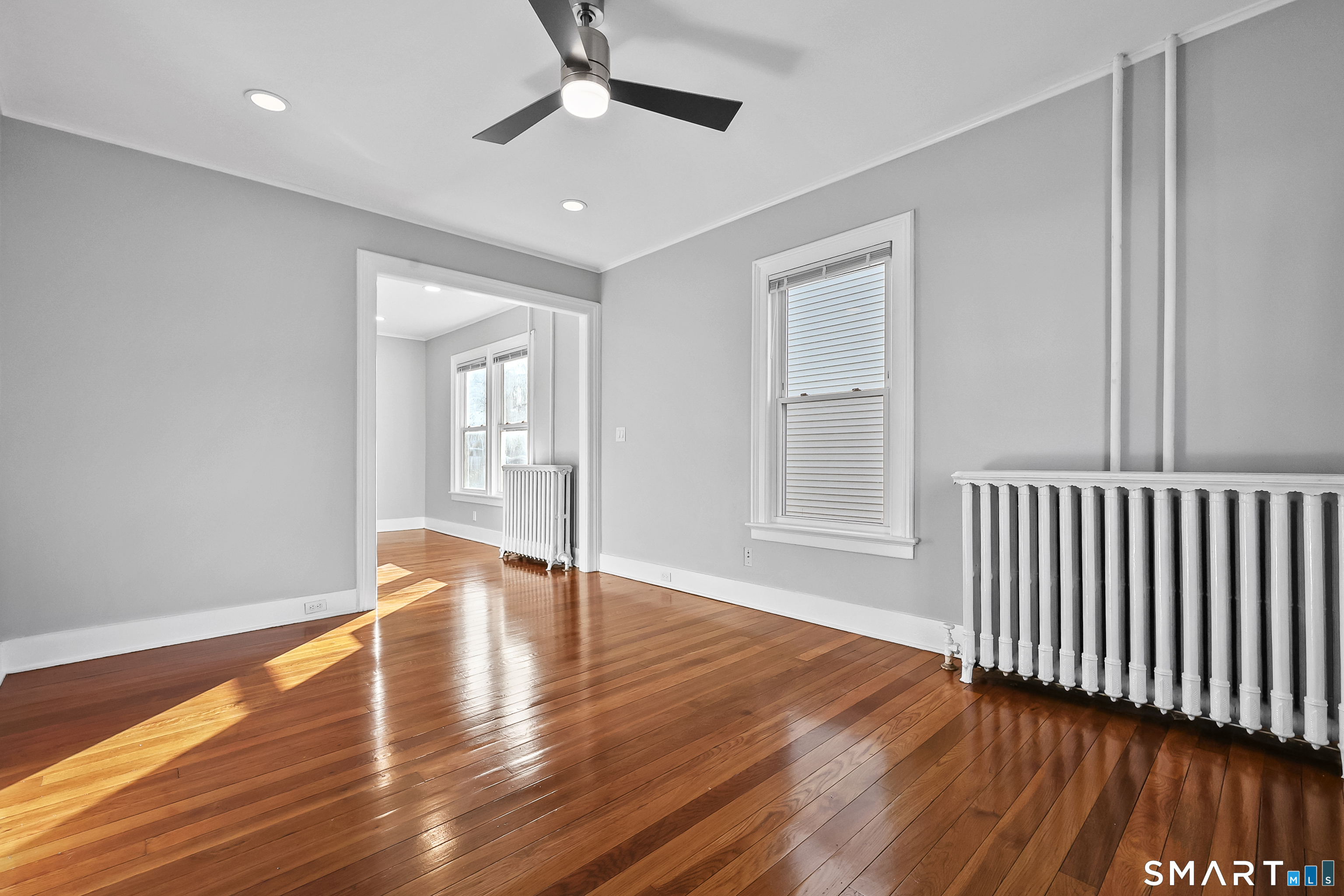 59 Grand Street Middletown, CT 06457 - Photo 10 of 33 wooden floor in an empty room with a window