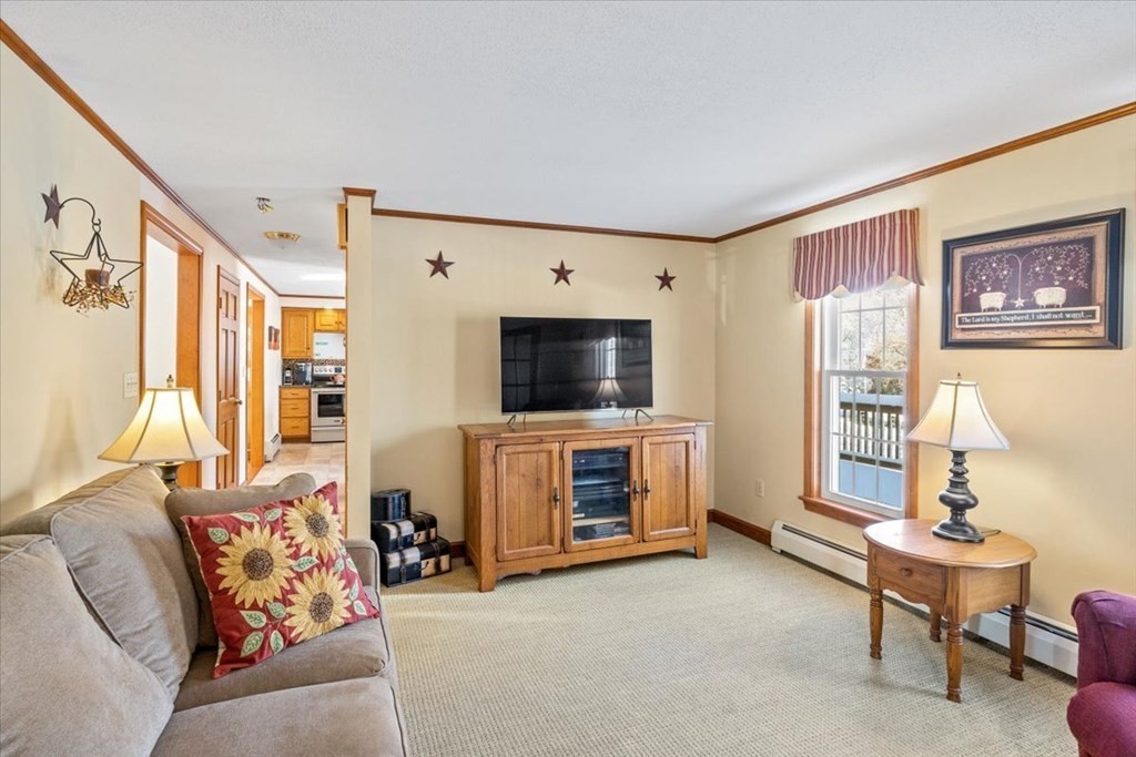 5 Sandy Lane Assonet, MA 02702 - Photo 12 of 34 a living room with furniture and a flat screen tv