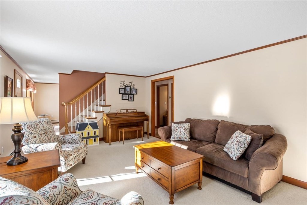 5 Sandy Lane Assonet, MA 02702 - Photo 21 of 34 a living room with furniture and a fireplace