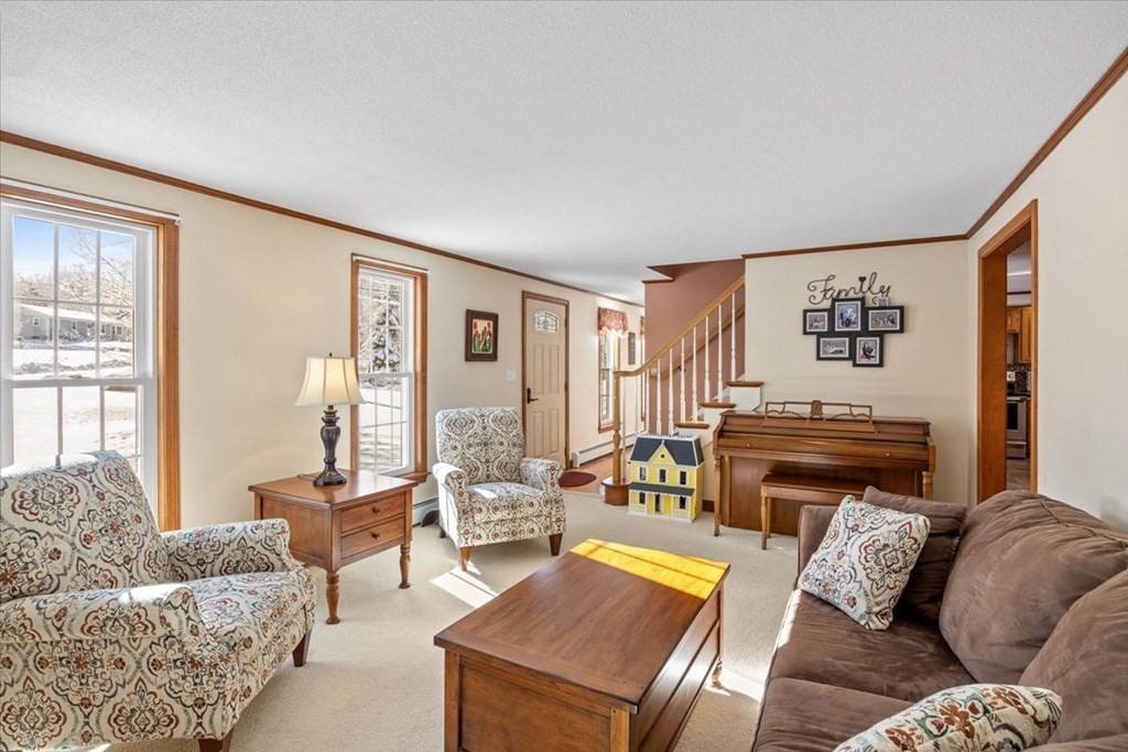 5 Sandy Lane Assonet, MA 02702 - Photo 22 of 34 a living room with furniture and a fireplace