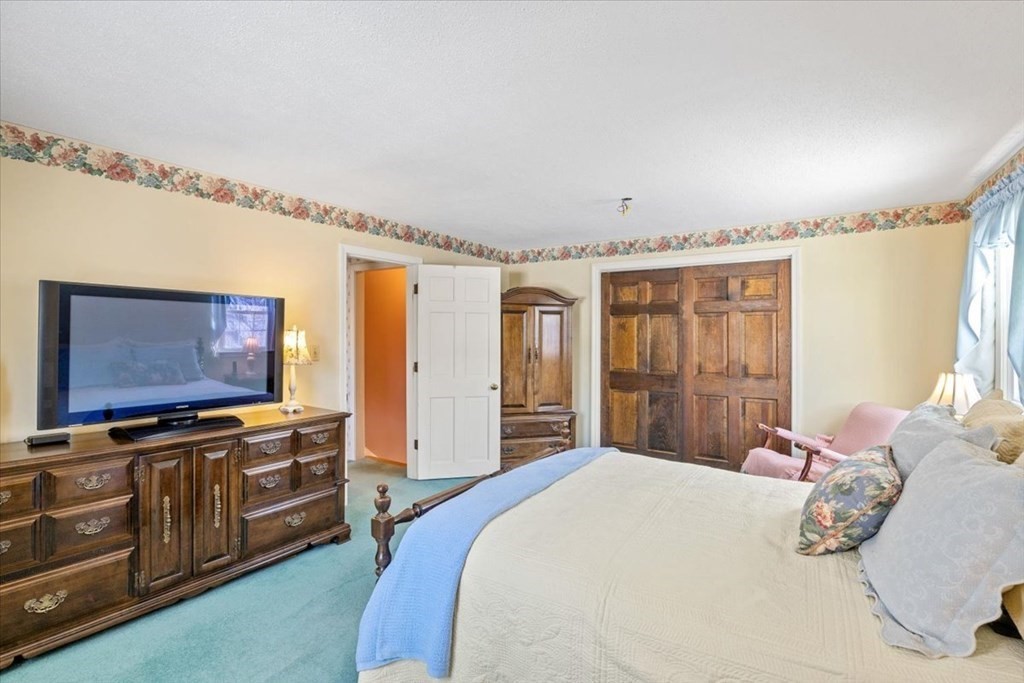 5 Sandy Lane Assonet, MA 02702 - Photo 25 of 34 a bedroom with a bed and a flat screen tv
