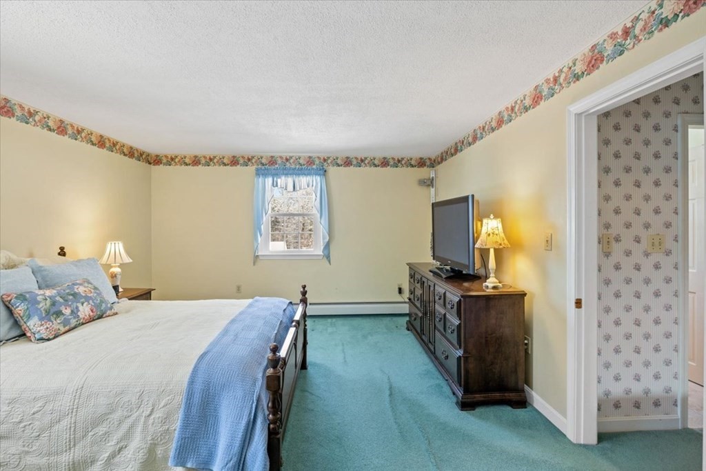 5 Sandy Lane Assonet, MA 02702 - Photo 26 of 34 a bedroom with a bed and a flat screen tv