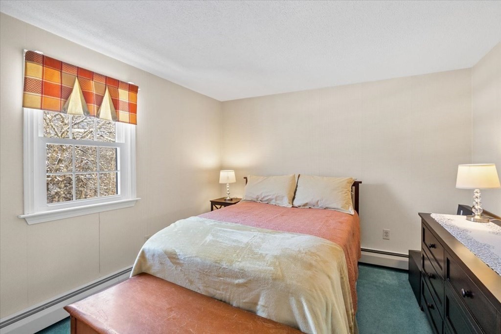 5 Sandy Lane Assonet, MA 02702 - Photo 28 of 34 a bedroom with a bed and a lamp next to a window