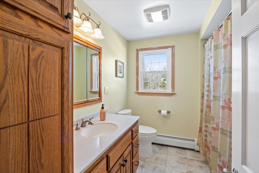 5 Sandy Lane Assonet, MA 02702 - Photo 31 of 34 a bathroom with a sink a toilet and shower