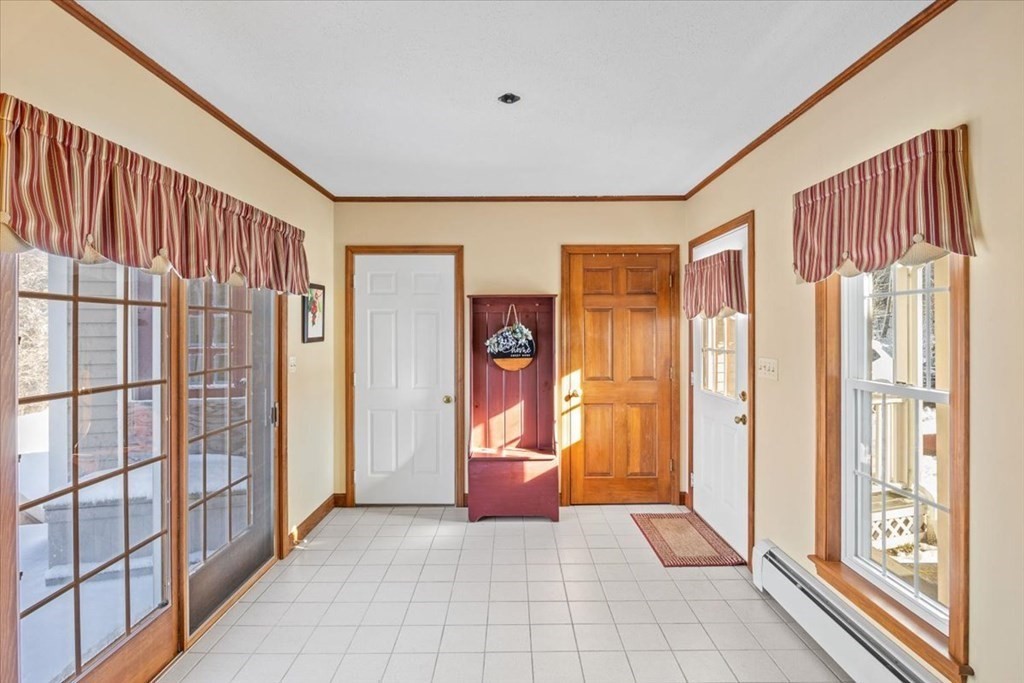 5 Sandy Lane Assonet, MA 02702 - Photo 8 of 34 a view of an entryway with wooden floor and door