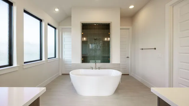 a bathroom with a bathtub and a sink