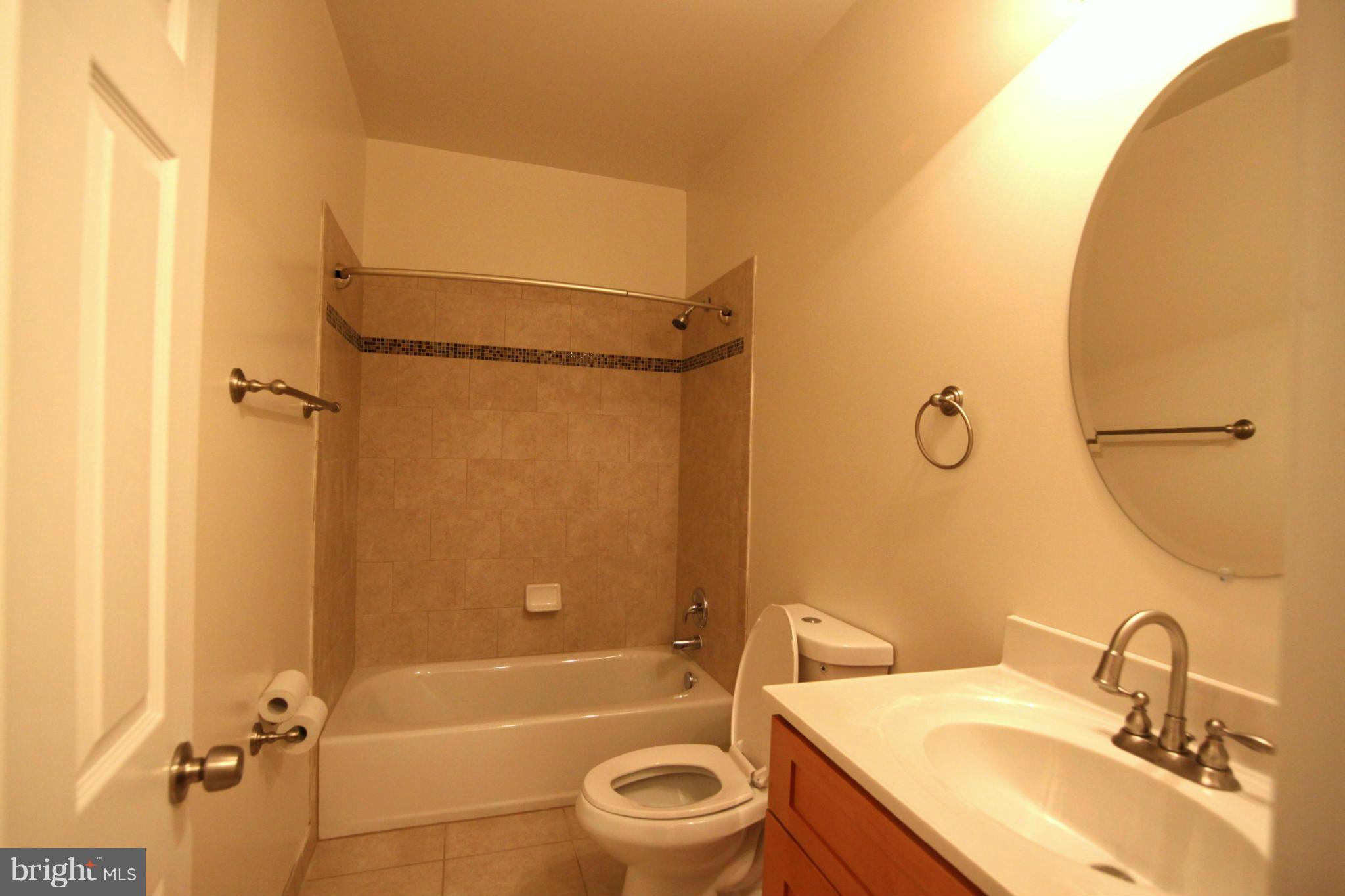 23100 Neck Road Aquasco, MD 20608 - Photo 15 of 30 Main floor hall full bath