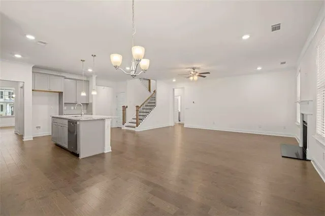 a view of a kitchen with a sink and a refrigerator