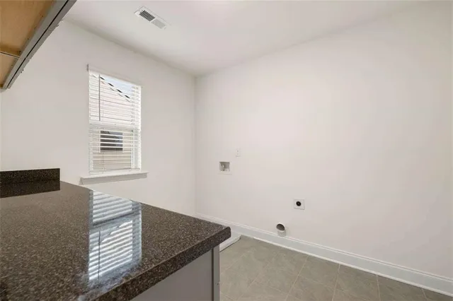 a view of kitchen cabinets and window